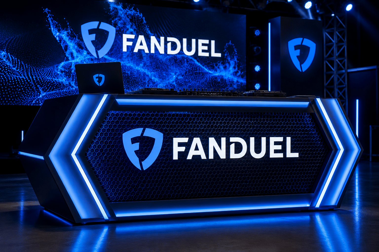 Custom illuminated DJ booth with branded graphics, LED lighting, and experiential event fabrication for corporate events and brand activations.