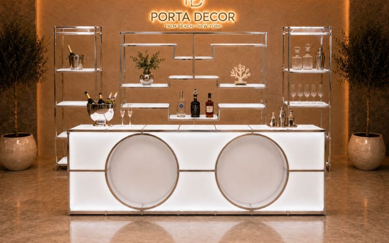 Custom event furniture fabrication featuring branded lounge seating, illuminated counters, and experiential activation furniture designed for trade shows and brand events.
